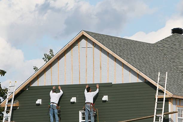 Professional Vinyl Siding technician working in Keene, VA